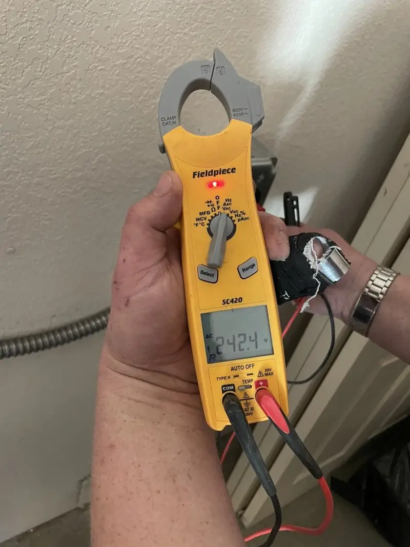 Voltage testing with clamp meter during Hot Tub / Pool Electrical Wiring in Exeter